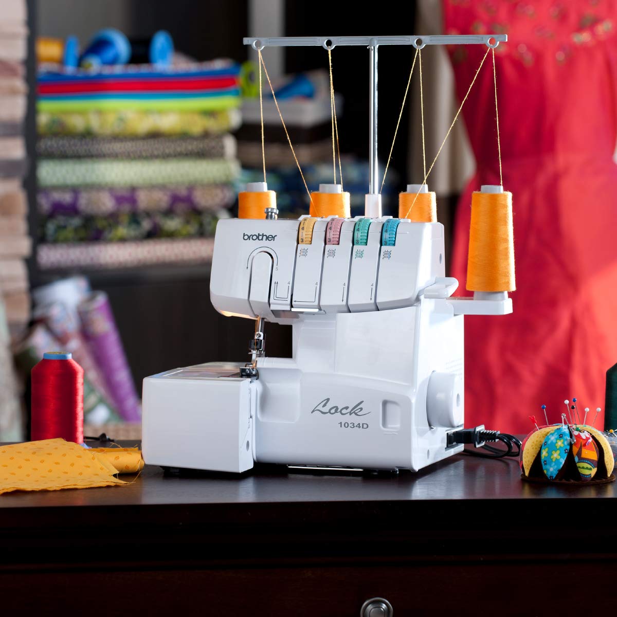 Brother Serger, 1034D, Heavy-Duty Metal Frame Overlock Machine, 1,300 Stitches Per Minute, Removeable Trim Trap, 3 Included Accessory Feet, White