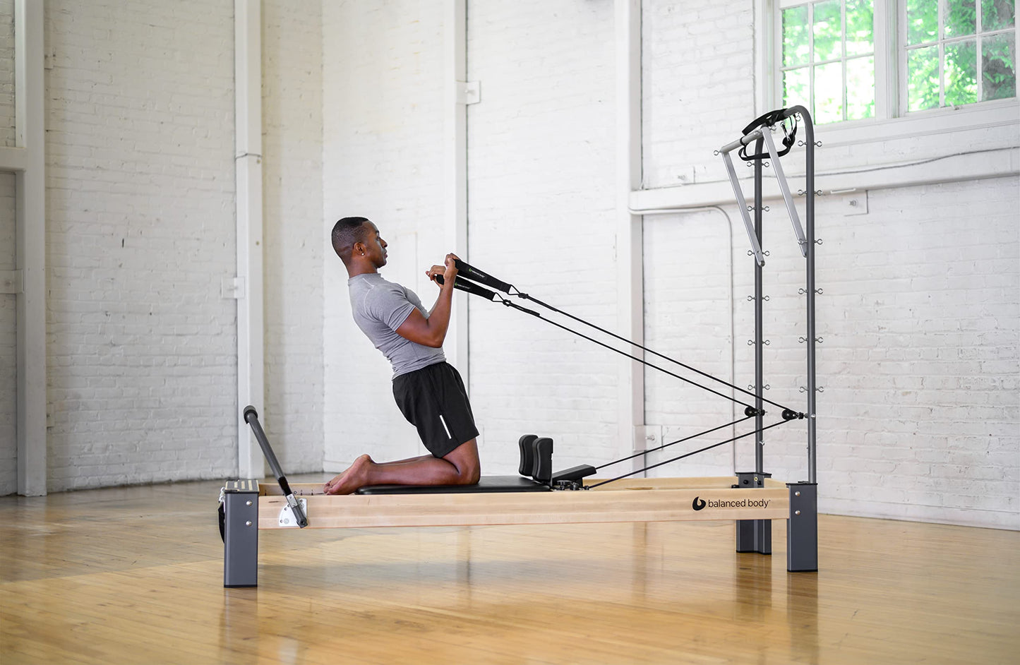 Balanced Body Rialto Pilates Reformer with Tower and Mat Conversion, Pilates Exercise Equipment, Workout Equipment for Home or Studio, Black Upholstery